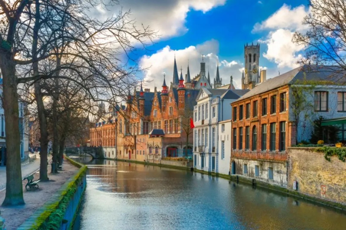 belfort and the green canal in bruges belgium picture id470770116 150x150