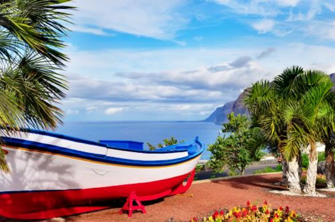 fishing boat on display near the ocean in Los Gigantes Tenerife 120x100